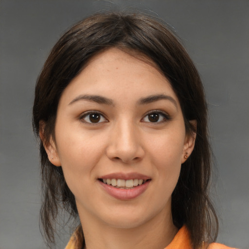 Joyful white young-adult female with medium  brown hair and brown eyes