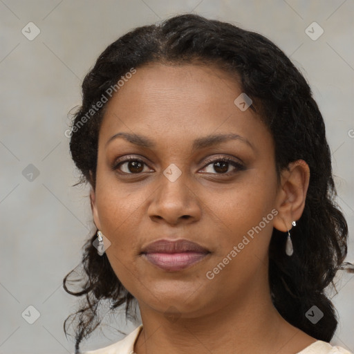 Joyful black young-adult female with medium  brown hair and brown eyes