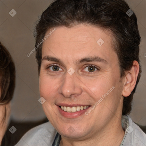 Joyful white adult male with medium  brown hair and brown eyes