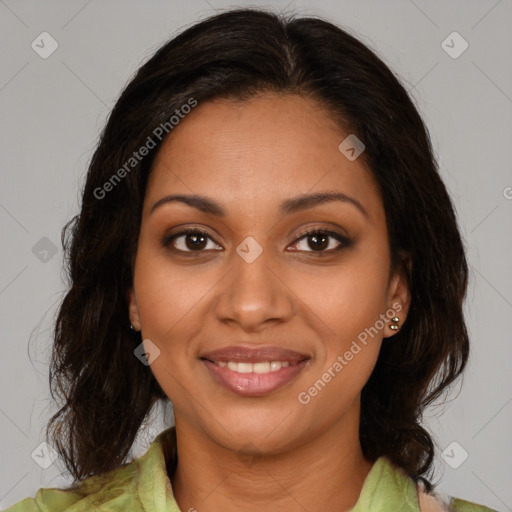 Joyful black young-adult female with medium  brown hair and brown eyes