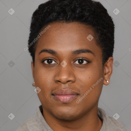 Joyful black young-adult female with short  black hair and brown eyes