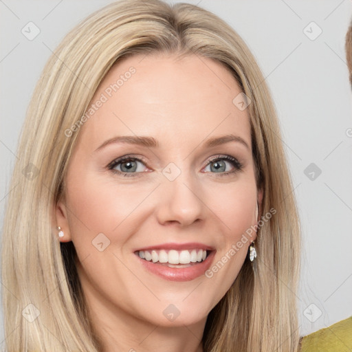 Joyful white young-adult female with long  brown hair and blue eyes