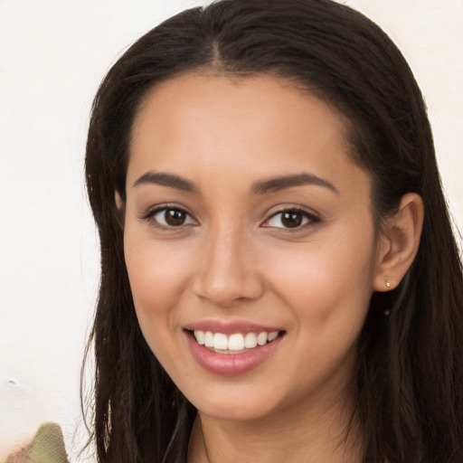 Joyful white young-adult female with long  brown hair and brown eyes