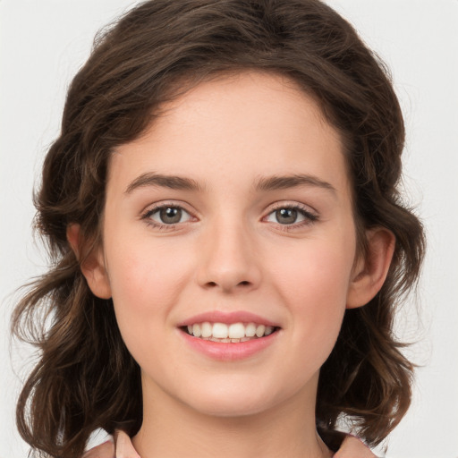 Joyful white young-adult female with medium  brown hair and green eyes