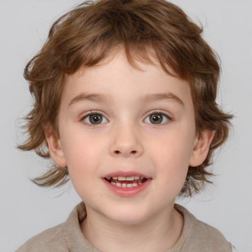 Joyful white child male with medium  brown hair and brown eyes