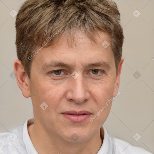 Joyful white adult male with short  brown hair and grey eyes