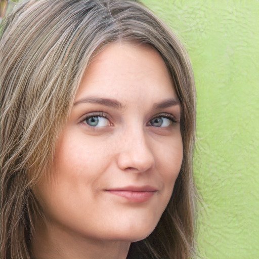 Neutral white young-adult female with long  brown hair and green eyes