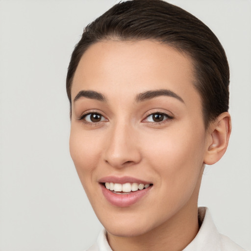 Joyful white young-adult female with short  brown hair and brown eyes