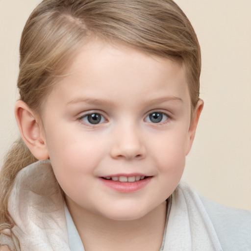 Joyful white child female with short  brown hair and blue eyes