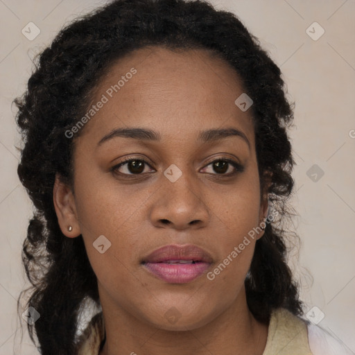 Joyful black adult female with medium  brown hair and brown eyes