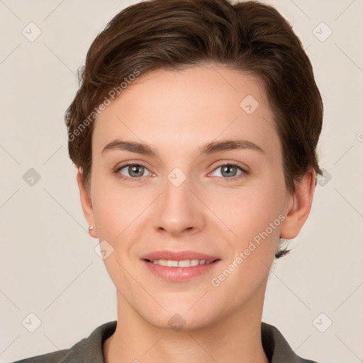 Joyful white young-adult female with short  brown hair and grey eyes