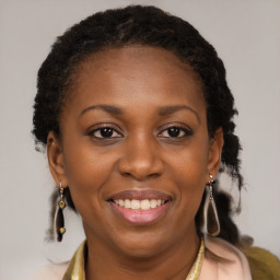 Joyful black young-adult female with medium  brown hair and brown eyes