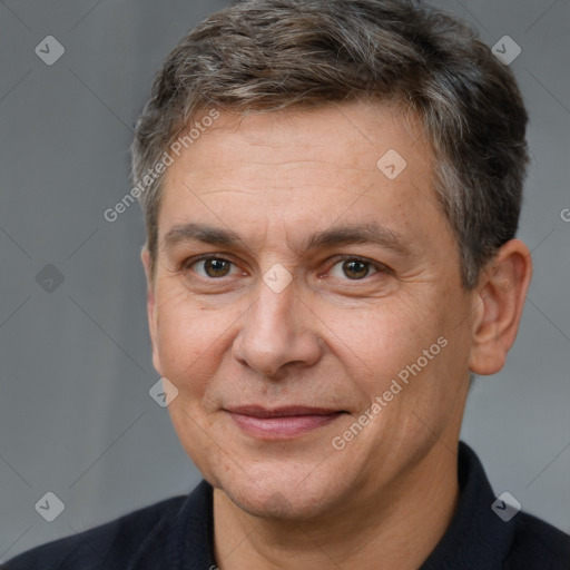 Joyful white adult male with short  brown hair and brown eyes