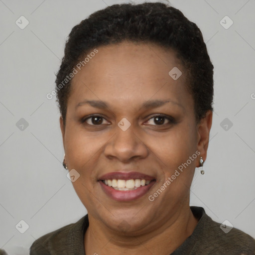 Joyful latino young-adult female with short  brown hair and brown eyes