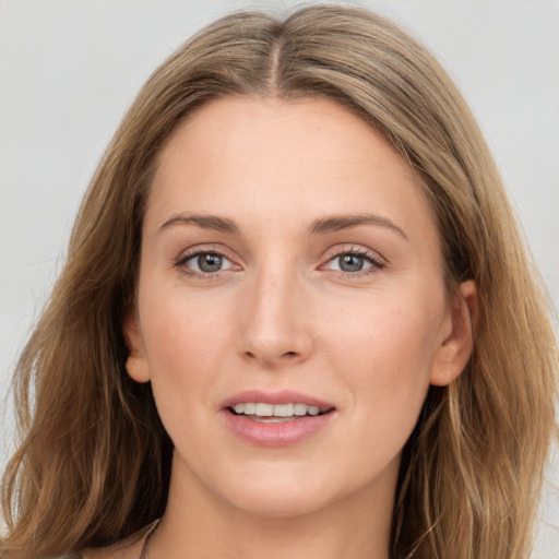 Joyful white young-adult female with long  brown hair and grey eyes