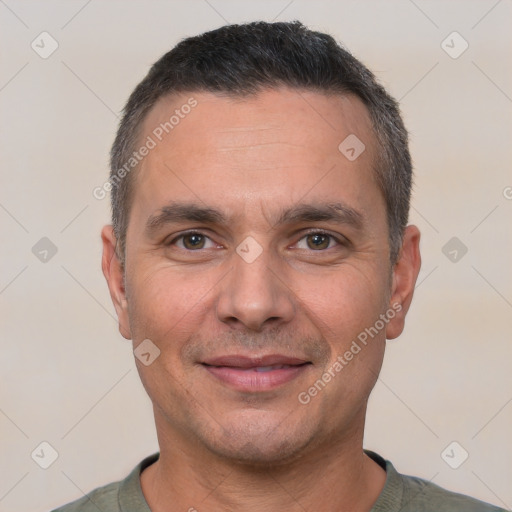 Joyful white adult male with short  brown hair and brown eyes