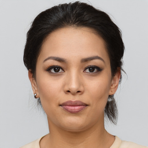 Joyful asian young-adult female with medium  brown hair and brown eyes