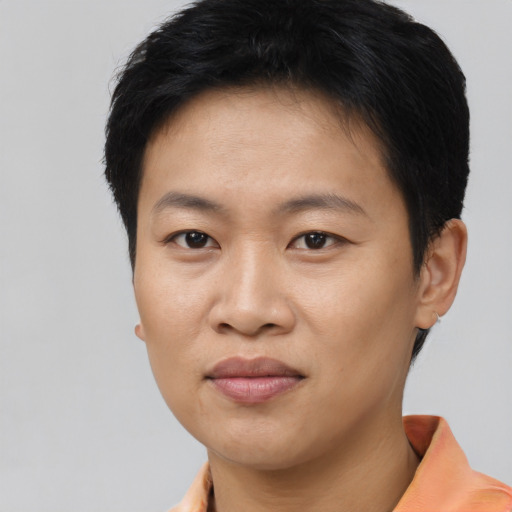 Joyful asian young-adult female with short  brown hair and brown eyes