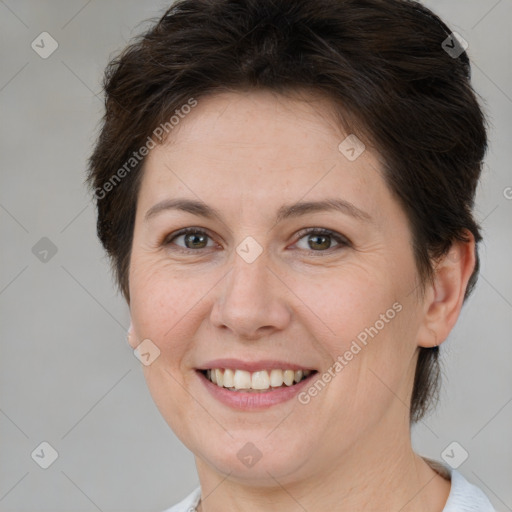 Joyful white adult female with short  brown hair and brown eyes