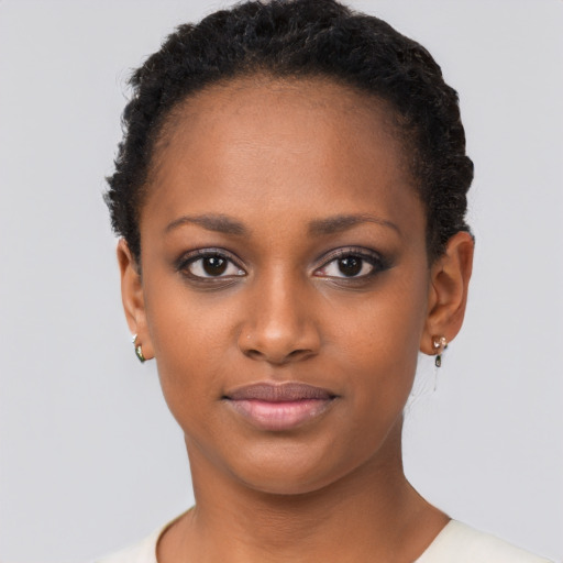 Joyful black young-adult female with short  brown hair and brown eyes