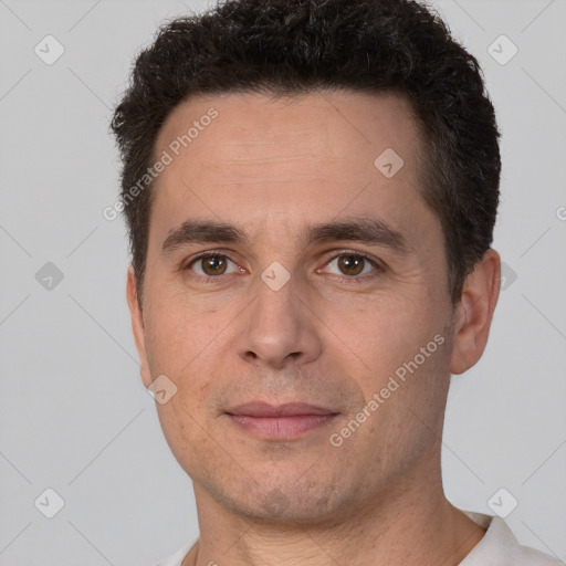 Joyful white adult male with short  brown hair and brown eyes