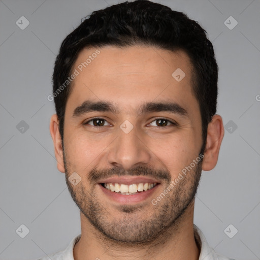 Joyful white young-adult male with short  black hair and brown eyes