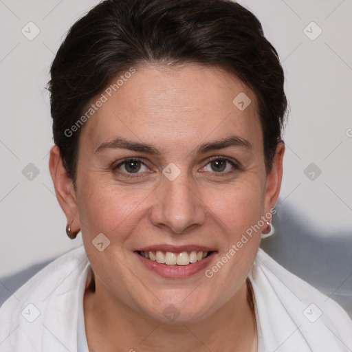 Joyful white adult female with short  brown hair and brown eyes