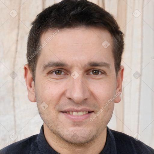 Joyful white adult male with short  brown hair and brown eyes