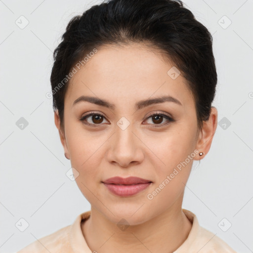 Joyful latino young-adult female with short  brown hair and brown eyes