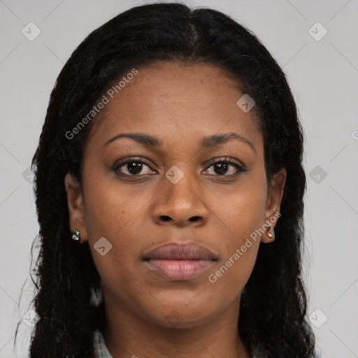 Joyful black young-adult female with long  brown hair and brown eyes