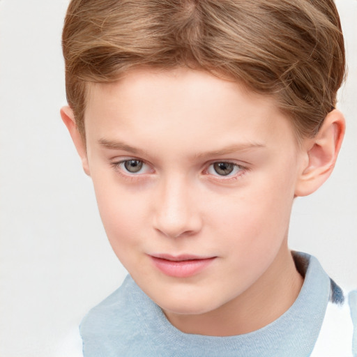 Joyful white child male with short  brown hair and grey eyes