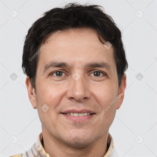 Joyful white adult male with short  brown hair and brown eyes