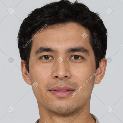 Joyful asian young-adult male with short  brown hair and brown eyes