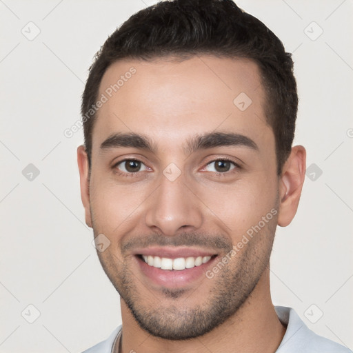 Joyful white young-adult male with short  brown hair and brown eyes