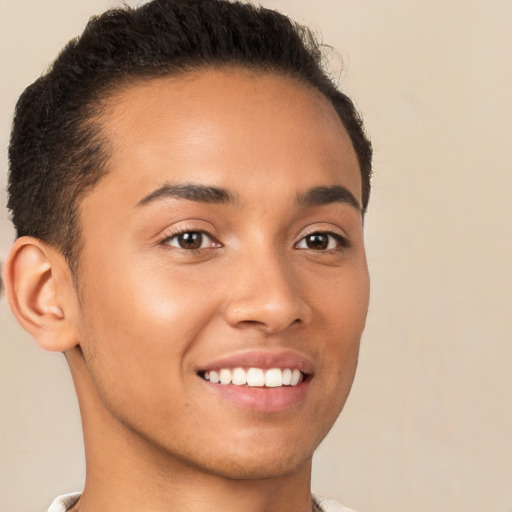 Joyful latino young-adult male with short  brown hair and brown eyes