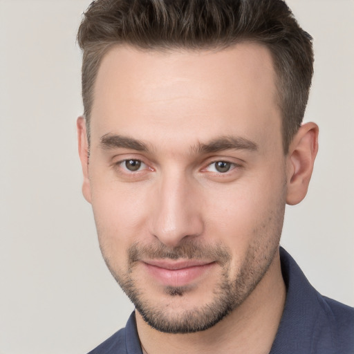 Joyful white young-adult male with short  brown hair and brown eyes