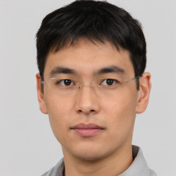 Neutral asian young-adult male with short  brown hair and brown eyes