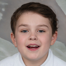 Joyful white child male with short  brown hair and brown eyes