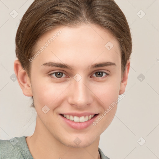 Joyful white young-adult female with short  brown hair and grey eyes