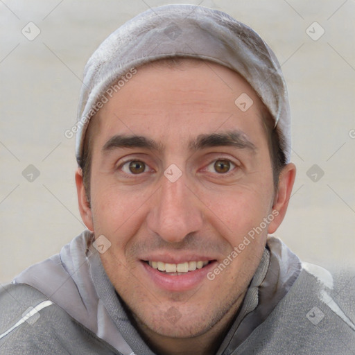 Joyful white adult male with short  brown hair and brown eyes