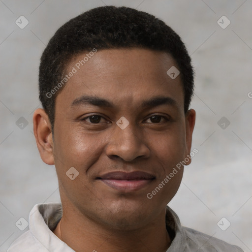 Joyful latino young-adult male with short  brown hair and brown eyes