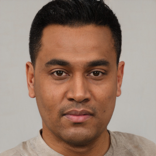 Neutral latino young-adult male with short  black hair and brown eyes