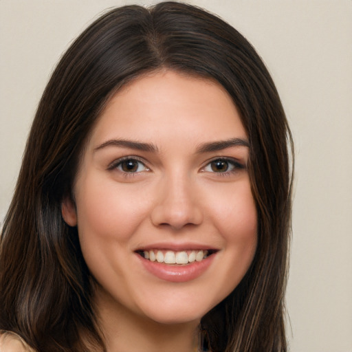 Joyful white young-adult female with long  brown hair and brown eyes