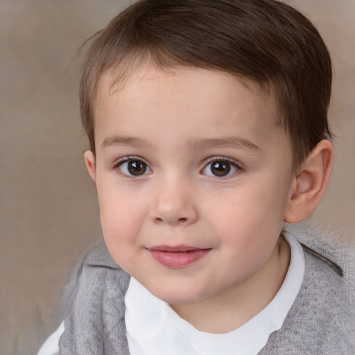 Joyful white child male with short  brown hair and brown eyes