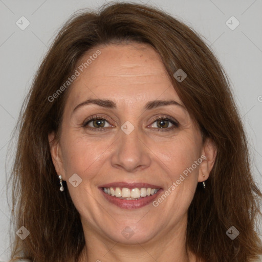 Joyful white adult female with long  brown hair and brown eyes