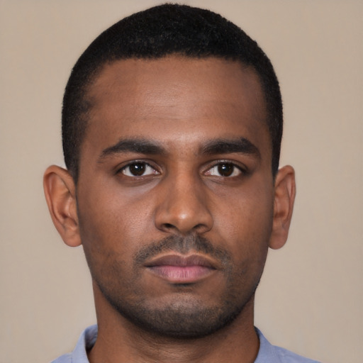 Neutral latino young-adult male with short  brown hair and brown eyes
