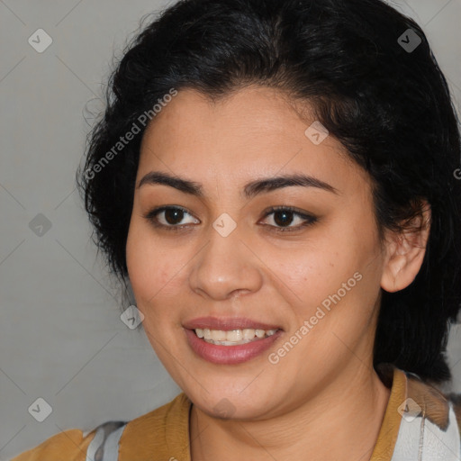 Joyful latino young-adult female with medium  brown hair and brown eyes