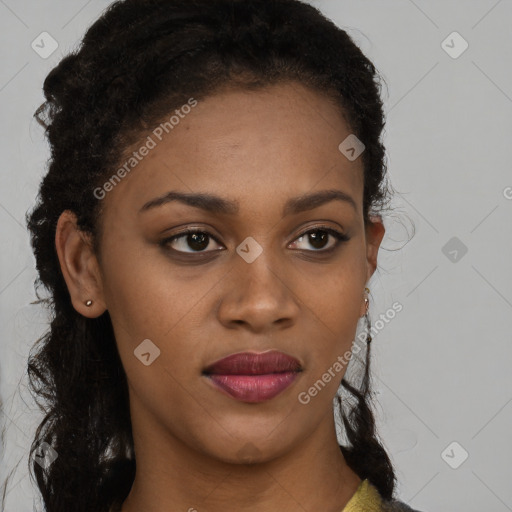 Joyful black young-adult female with long  brown hair and brown eyes