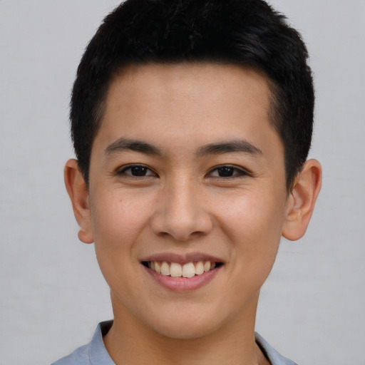 Joyful asian young-adult male with short  brown hair and brown eyes