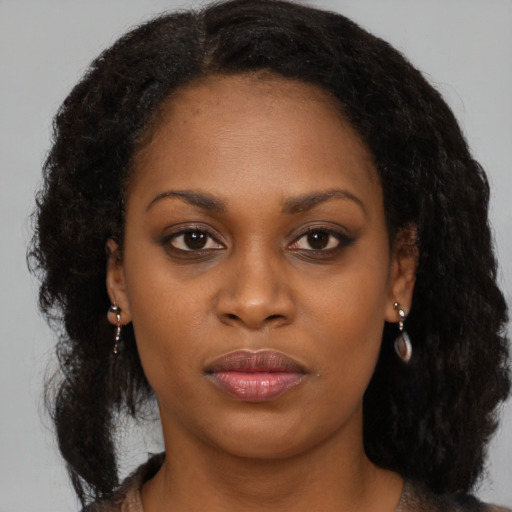 Neutral black young-adult female with medium  black hair and brown eyes